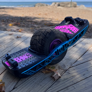 Violet purple Trail Crew and Podium combo FST TPU Grip by Good Day Grip Brand, trail-ready arrow design on a Onewheel GT VESC board by the beach